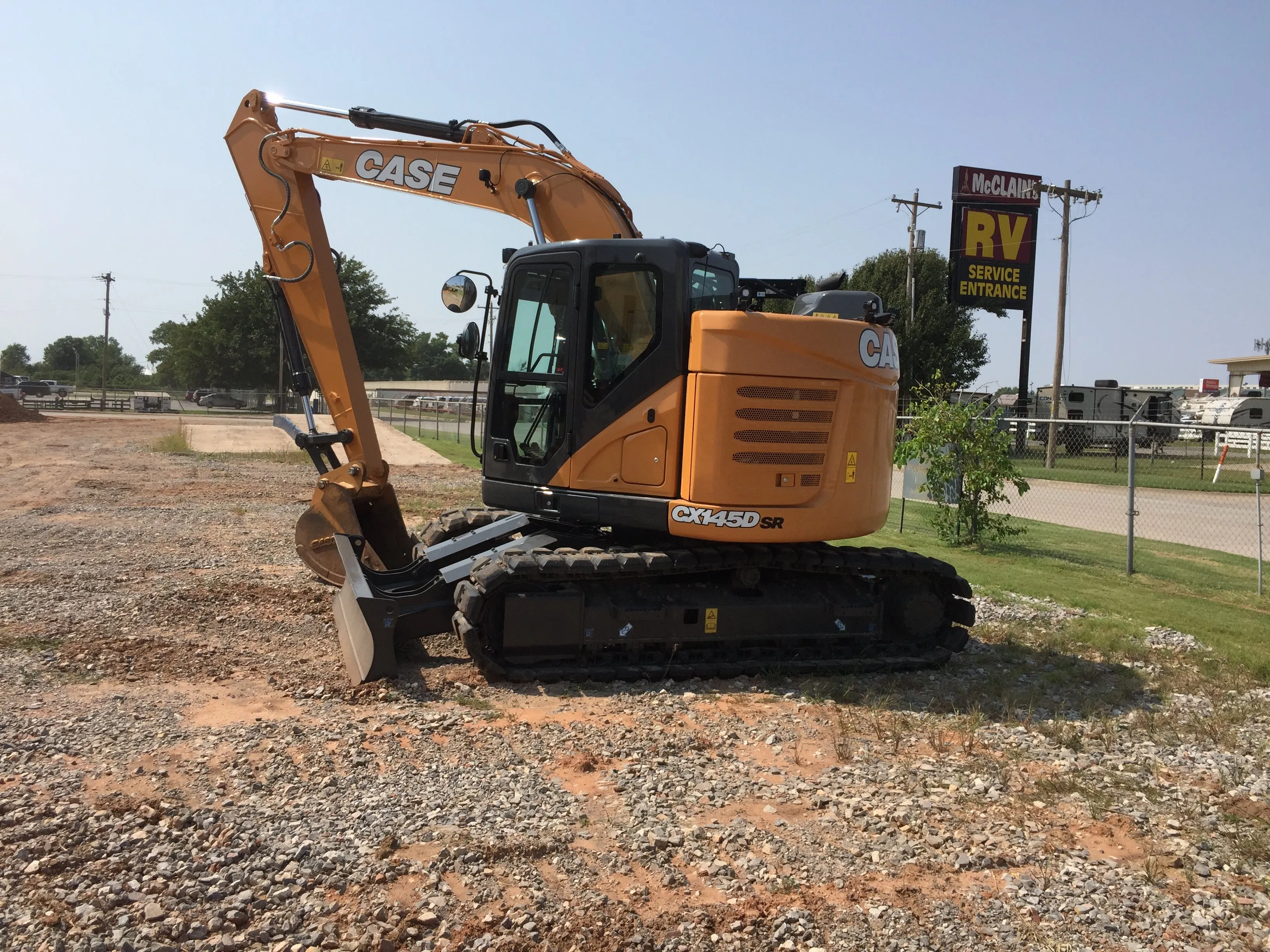 ABC's Case CX145 excavator parked on a gravel lot